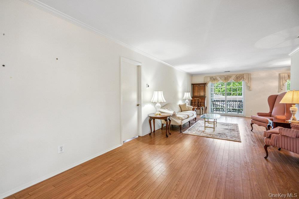 914 Fenway Road St. James, NY 11780 - Photo 5 of 35 a view of a livingroom with furniture and a window