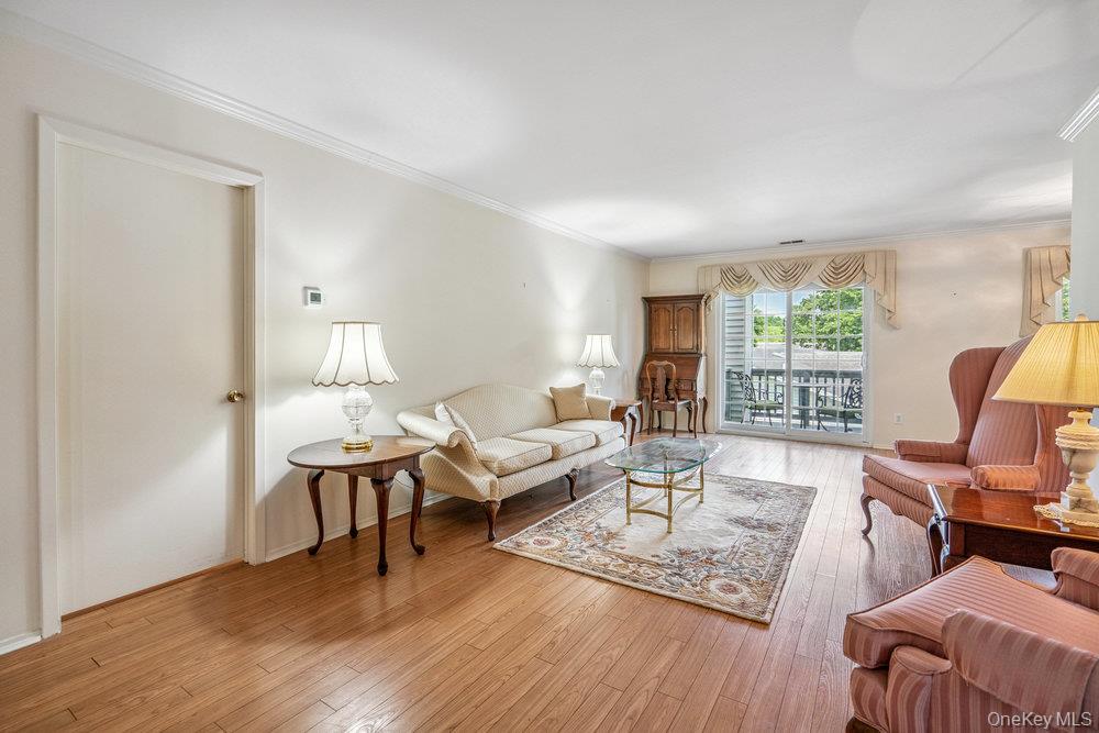 914 Fenway Road St. James, NY 11780 - Photo 8 of 35 a living room with furniture rug and window