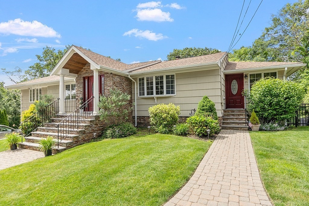 25 Viking Road Saugus, MA 01906 - Photo 1 of 33 a front view of house with yard and green space