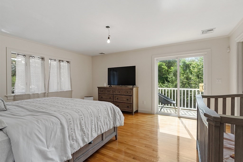 25 Viking Road Saugus, MA 01906 - Photo 17 of 33 a bedroom with a bed and a flat screen tv