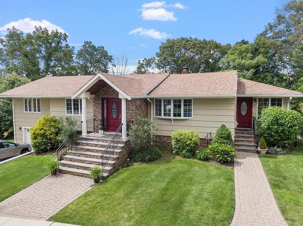 25 Viking Road Saugus, MA 01906 - Photo 2 of 33 a front view of a house with a yard