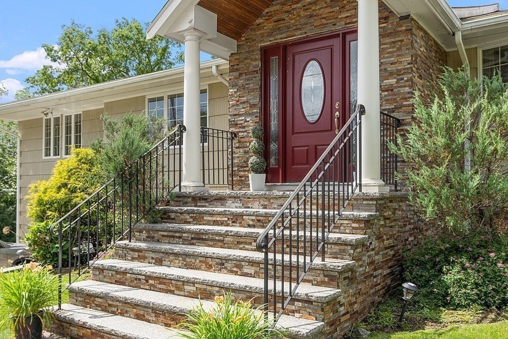 25 Viking Road Saugus, MA 01906 - Photo 3 of 33 a front view of a house with a garden