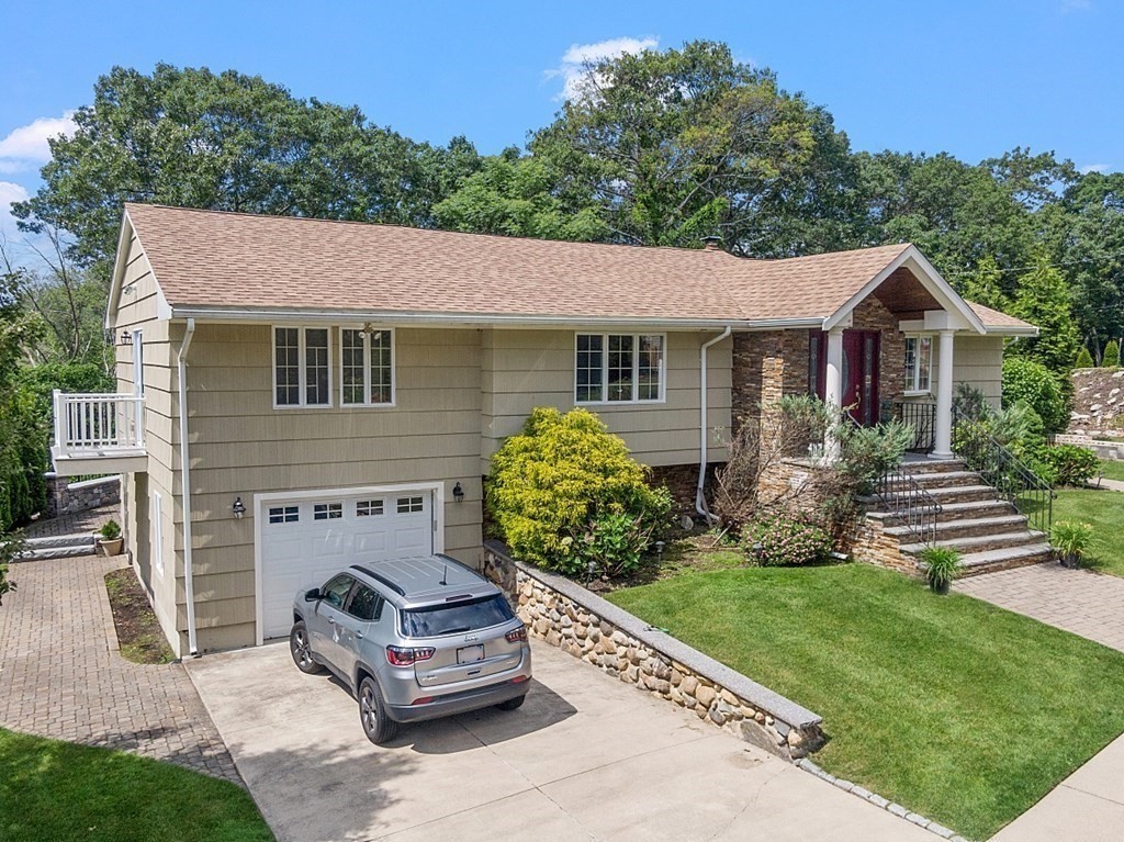 25 Viking Road Saugus, MA 01906 - Photo 33 of 33 a front view of a house with a garden