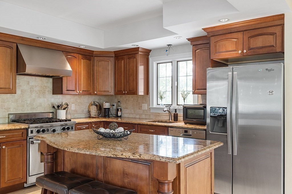 25 Viking Road Saugus, MA 01906 - Photo 6 of 33 a kitchen with stainless steel appliances granite countertop a sink stove and refrigerator