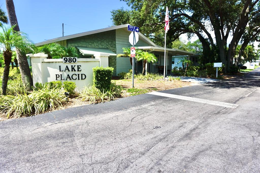 980 7th Street Northwest, Unit 71 Largo, FL 33770 - Photo 18 of 23 a view of a house with a yard and potted plants