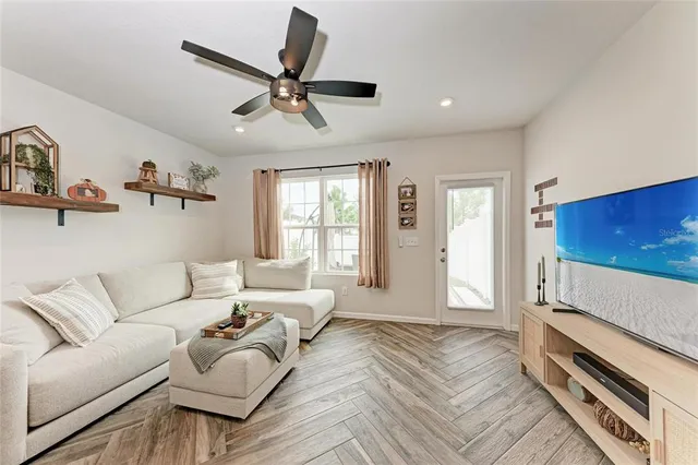 a living room with furniture and a window