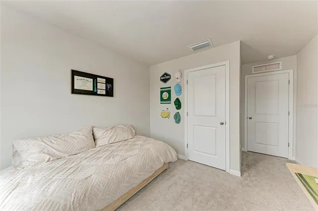 a bathroom with a sink a toilet and shower curtain