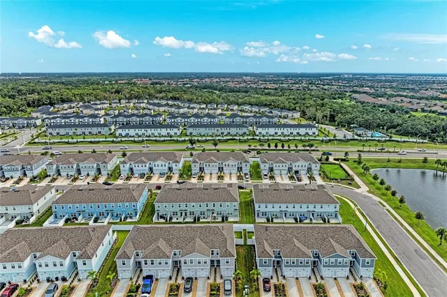 a view of a swimming pool with an outdoor seating