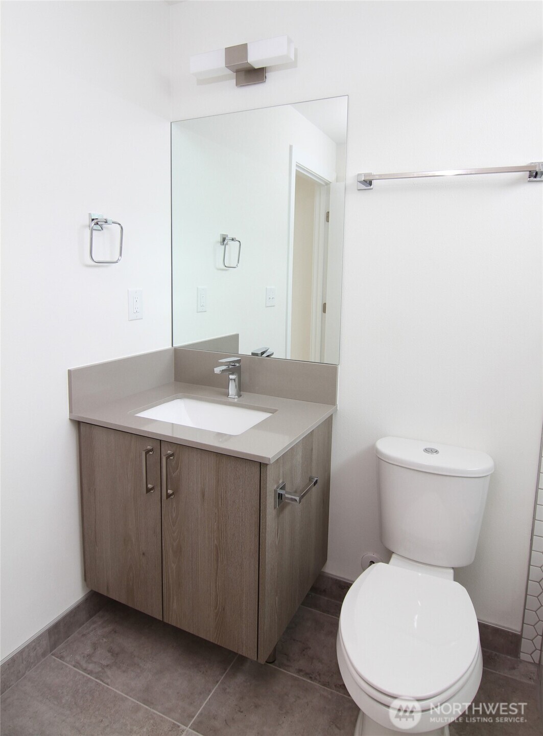 4724 31st Avenue South Seattle, WA 98108 - Photo 15 of 24 a bathroom with a sink vanity mirror and toilet