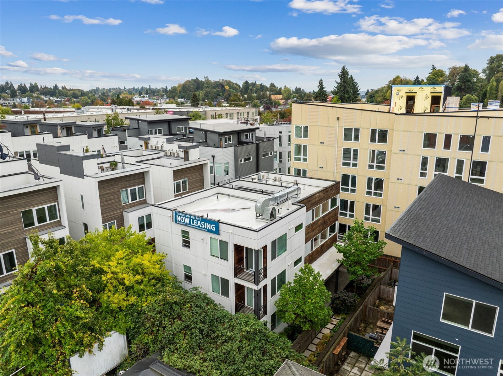 4724 31st Avenue South Seattle, WA 98108 - Photo 3 of 24 a view of a white building with a clock tower in the middle