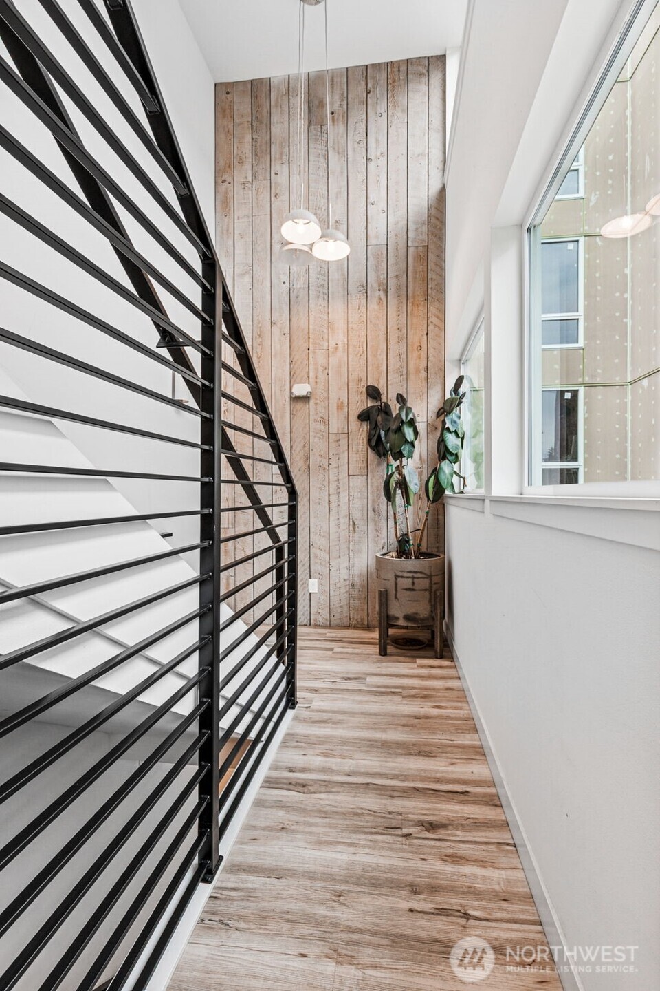 4724 31st Avenue South Seattle, WA 98108 - Photo 5 of 24 a view of a room with wooden floor and windows