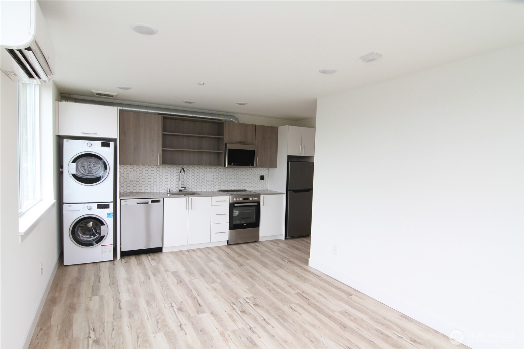 4724 31st Avenue South Seattle, WA 98108 - Photo 10 of 24 a kitchen with a refrigerator and a stove top oven