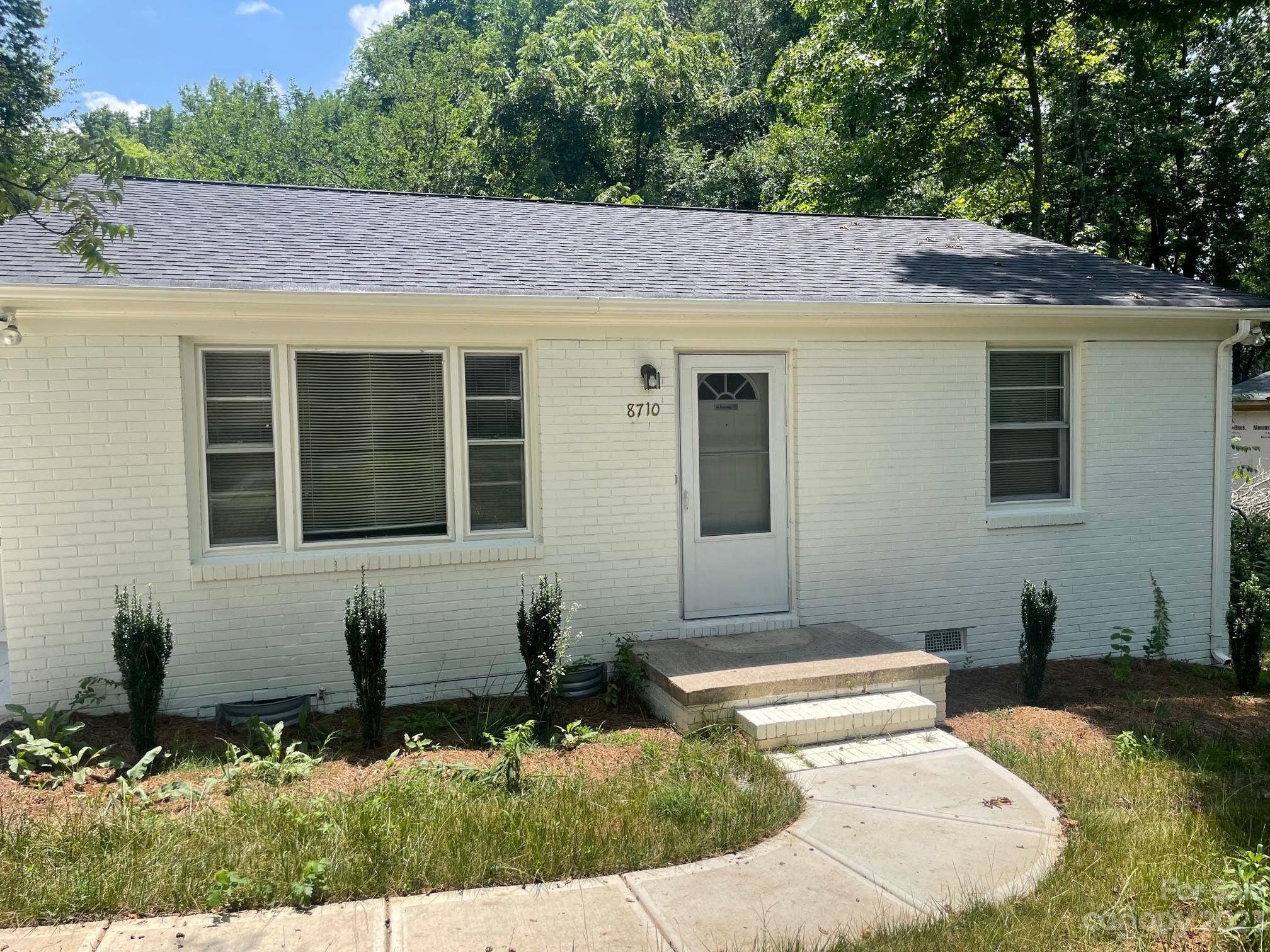 8710 Moody Road Charlotte, NC 28215 - Photo 2 of 14 a view of house with yard