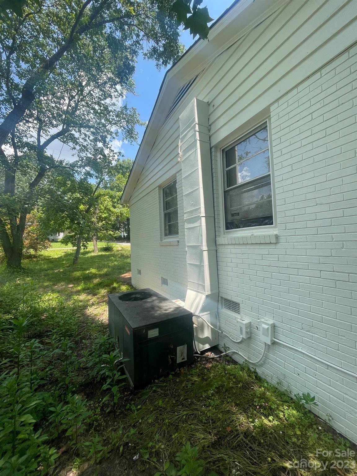 8710 Moody Road Charlotte, NC 28215 - Photo 5 of 14 a backyard of a house with table and chairs