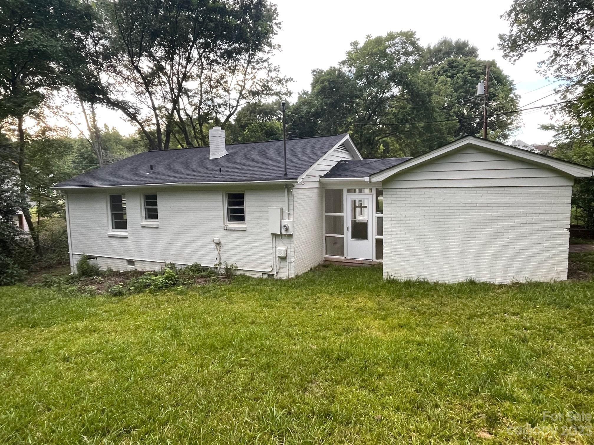8710 Moody Road Charlotte, NC 28215 - Photo 6 of 14 a view of a house with a yard