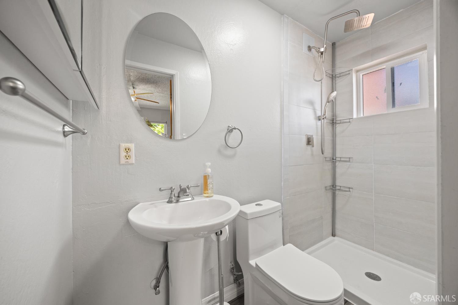 196 Loftus Road Pittsburg, CA 94565 - Photo 12 of 25 a bathroom with a sink toilet and shower