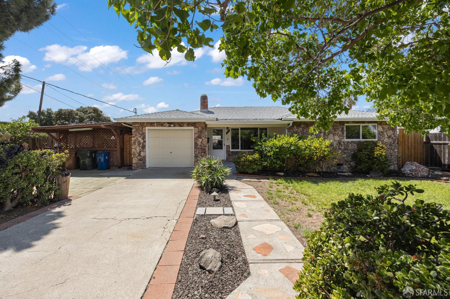 196 Loftus Road Pittsburg, CA 94565 - Photo 2 of 25 a front view of a house with garden