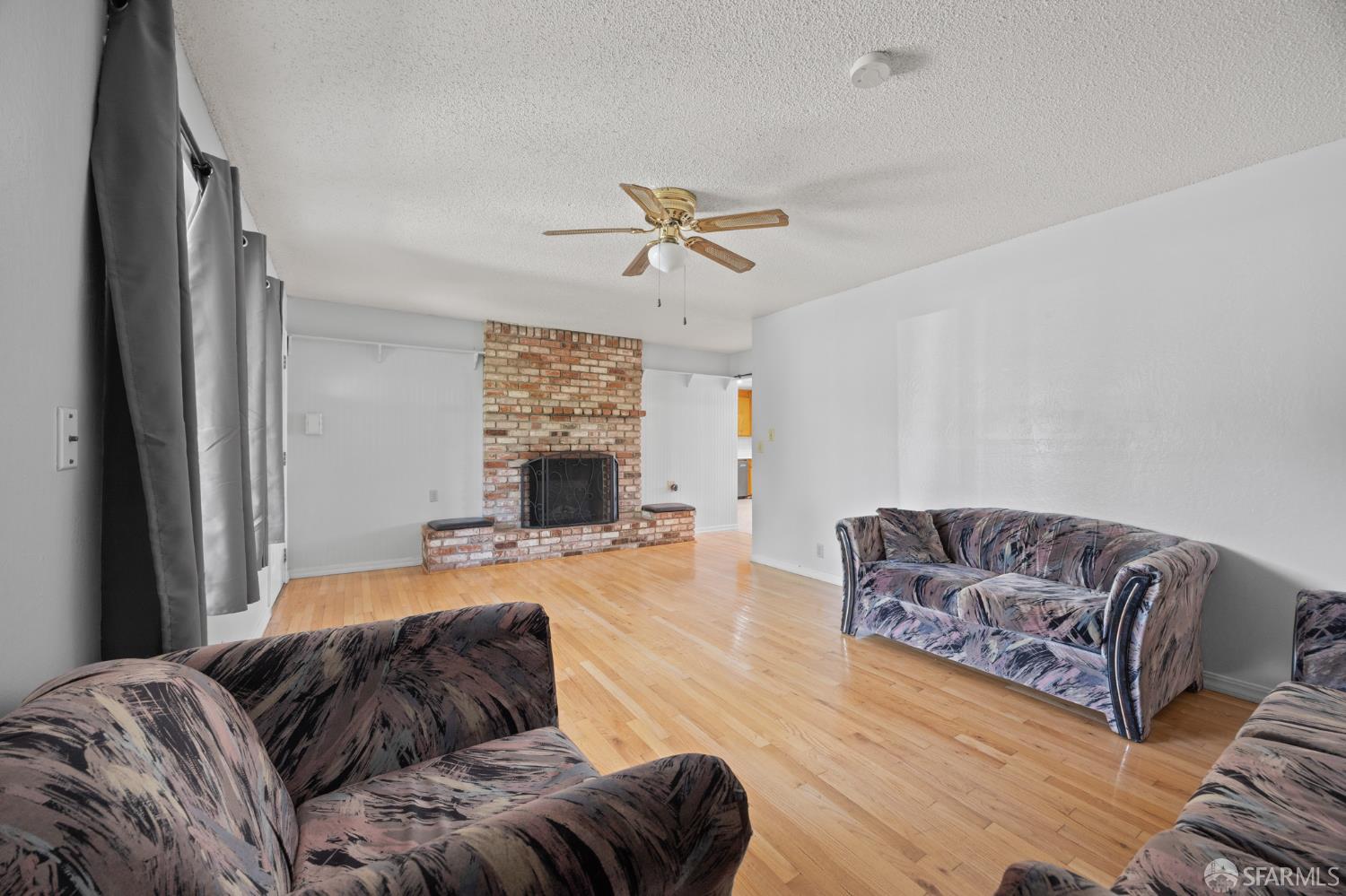 196 Loftus Road Pittsburg, CA 94565 - Photo 7 of 25 a bedroom with furniture and a fireplace