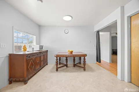a kitchen with a table and chairs