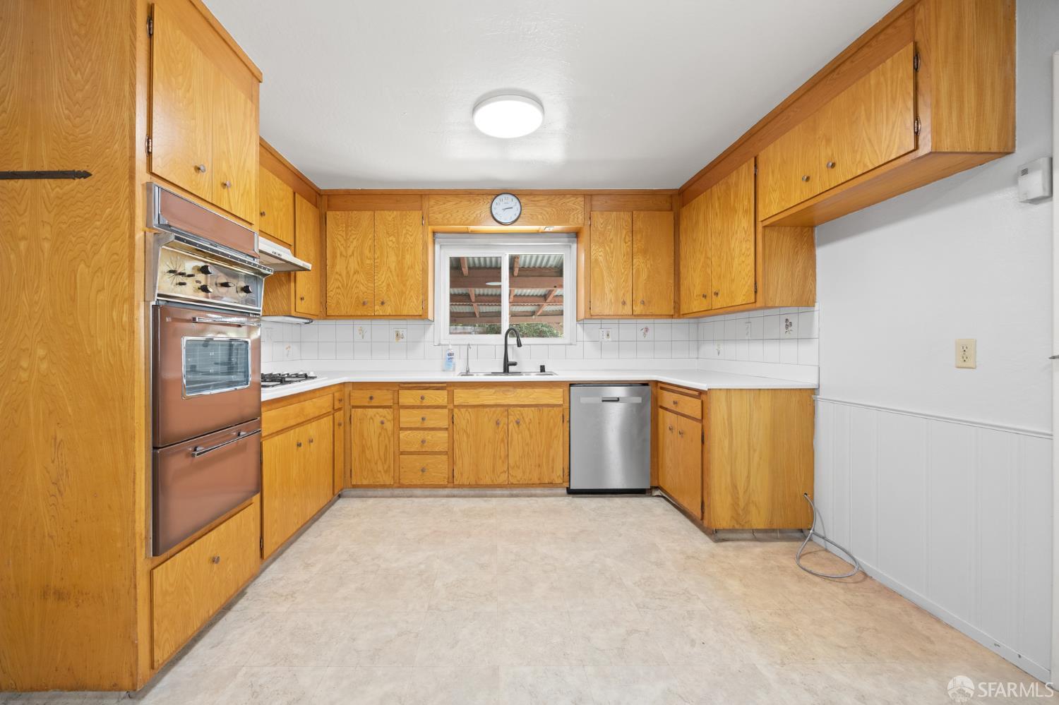 196 Loftus Road Pittsburg, CA 94565 - Photo 10 of 25 a kitchen with stainless steel appliances granite countertop a sink and cabinets