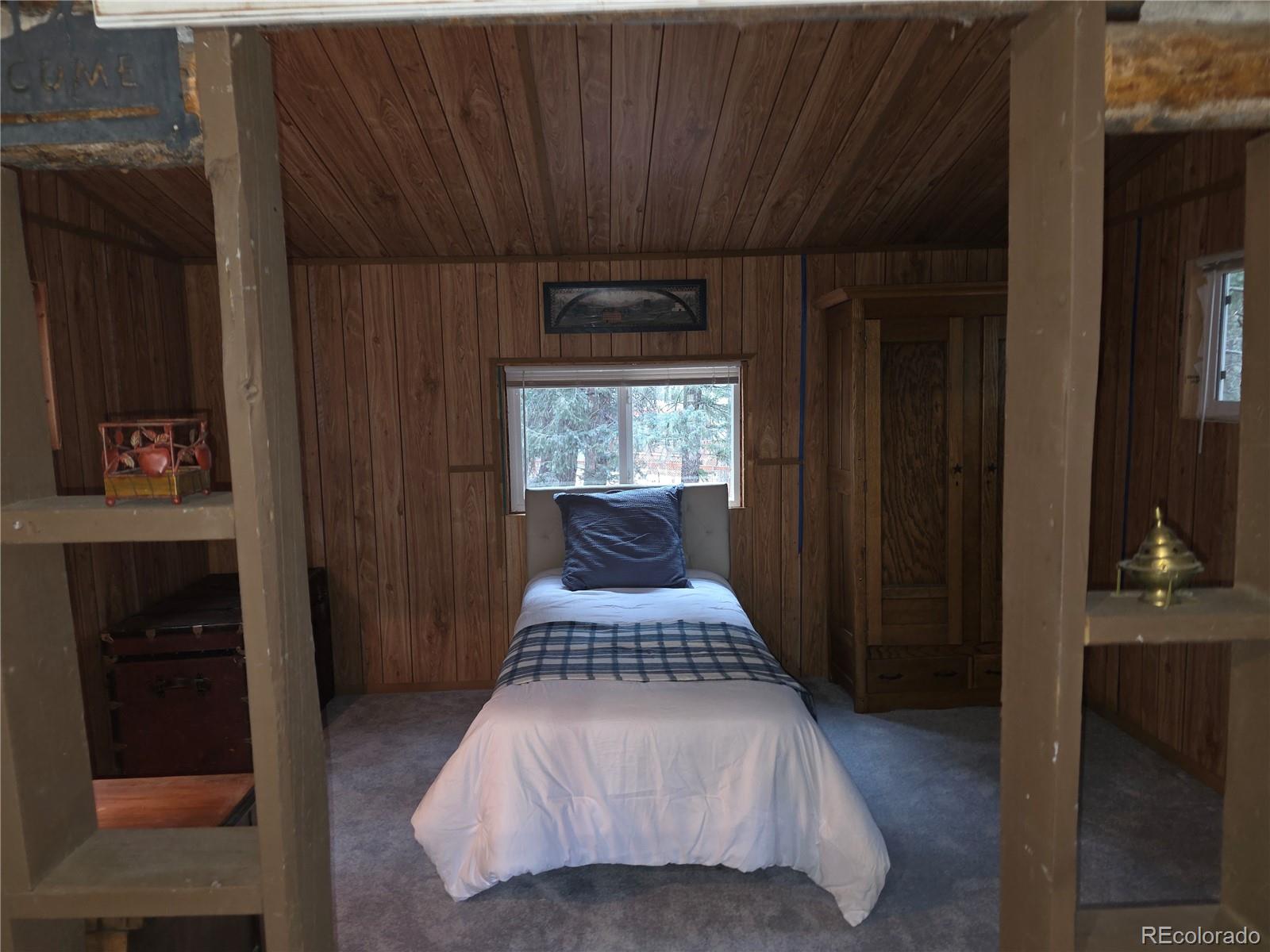 8830 South Blue Creek Road Evergreen, CO 80439 - Photo 34 of 39 a bathroom with a sink and a shower