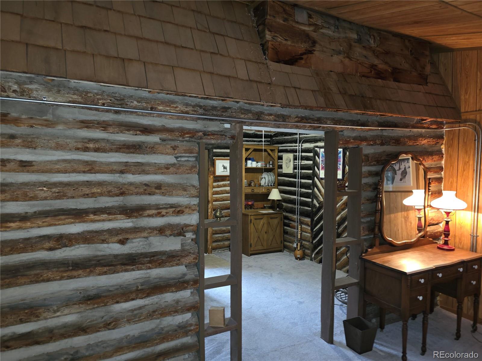8830 South Blue Creek Road Evergreen, CO 80439 - Photo 36 of 39 a view of walk in closet with clothes