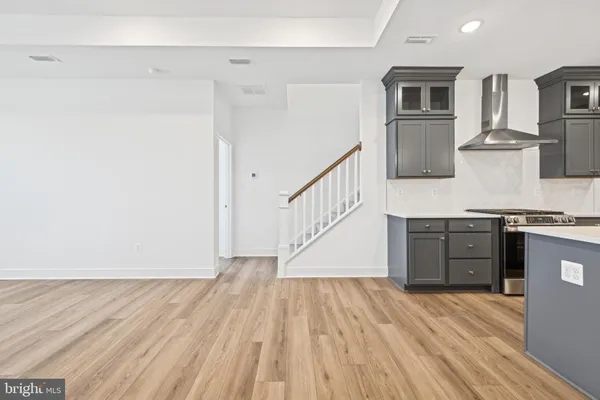 a view of a kitchen cabinets and wooden floor