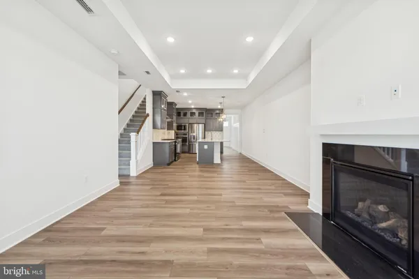 a view of kitchen with furniture and wooden floor