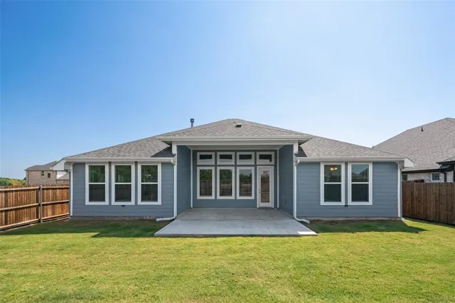 a view of a house with a yard and balcony
