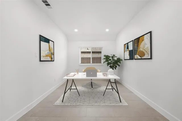 a workspace with furniture and window