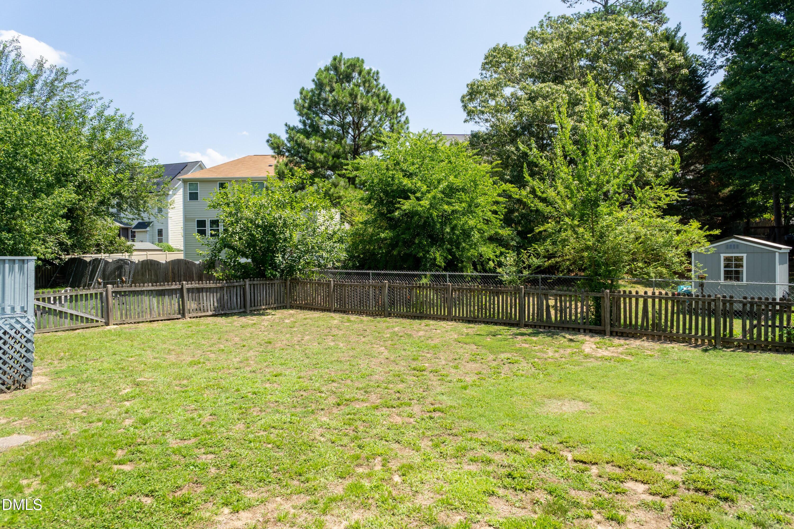 5604 Spring Pines Way Raleigh, NC 27616 - Photo 19 of 22 a swimming pool that is in front of a house