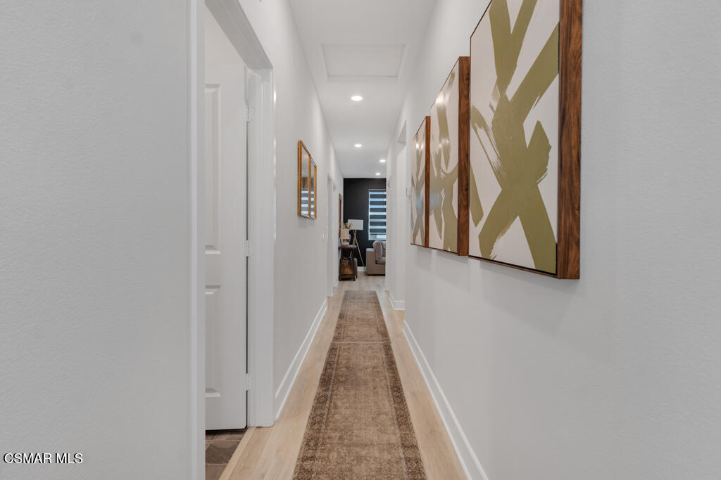 3028 Harrison Lane Simi Valley, CA 93065 - Photo 18 of 47 a view of a hallway with wooden floor and staircase