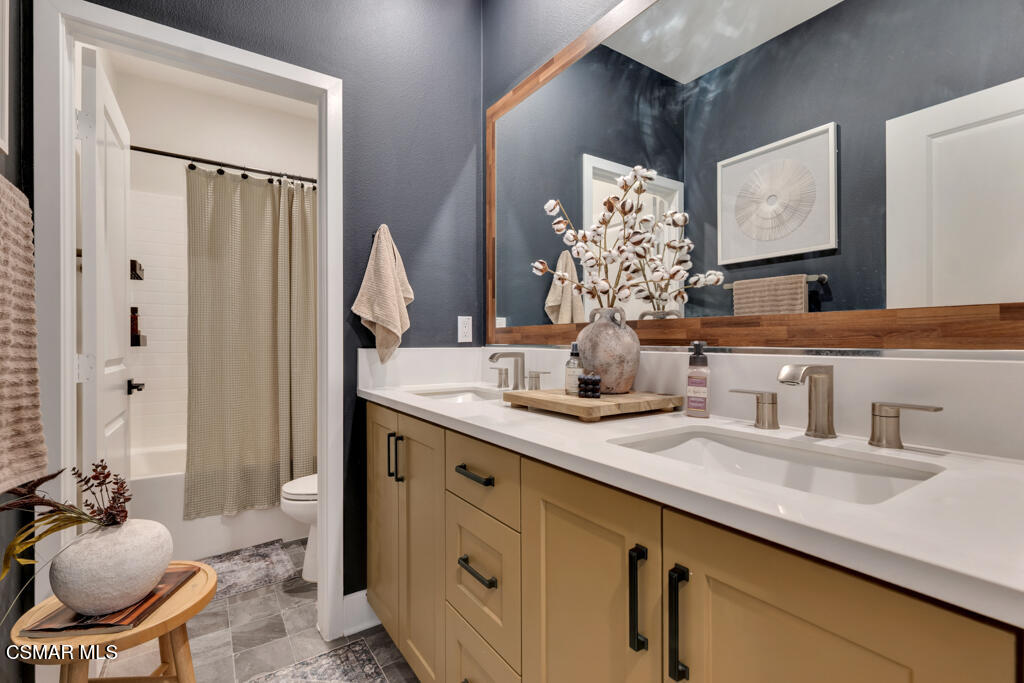 3028 Harrison Lane Simi Valley, CA 93065 - Photo 20 of 47 a bathroom with a granite countertop sink and a mirror