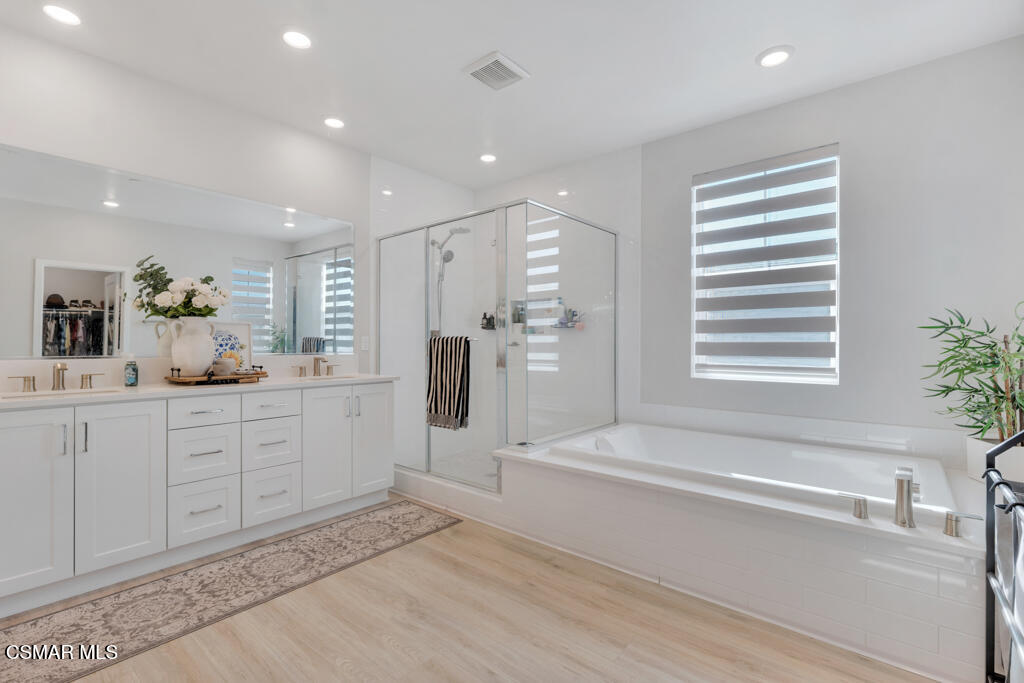 3028 Harrison Lane Simi Valley, CA 93065 - Photo 28 of 47 a spacious bathroom with a tub sink and mirror