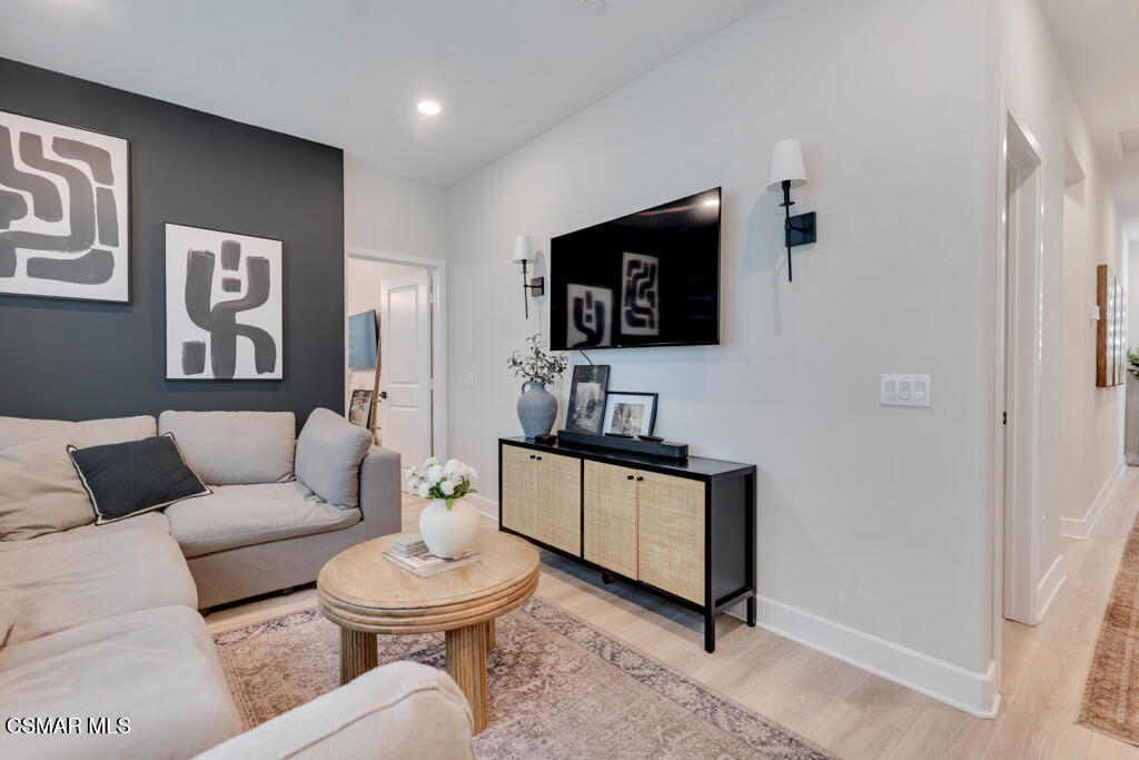 3028 Harrison Lane Simi Valley, CA 93065 - Photo 33 of 47 a living room with furniture a rug and a toilet
