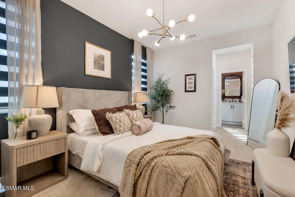 3028 Harrison Lane Simi Valley, CA 93065 - Photo 35 of 47 a bedroom with a bed and a chandelier
