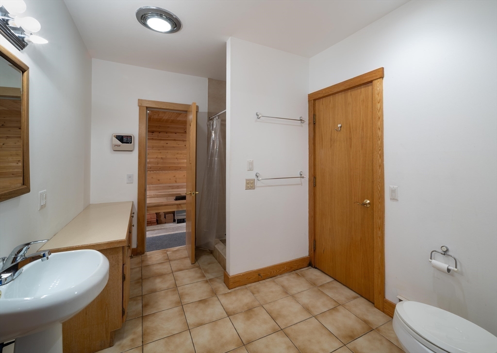 184 W Road Bernardston, MA 01337 - Photo 32 of 41 a bathroom with a sink a toilet and shower