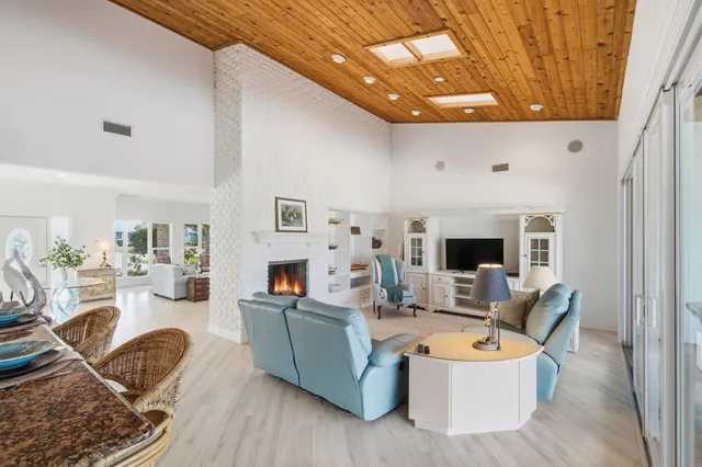 a kitchen with stainless steel appliances kitchen island granite countertop a stove and cabinets