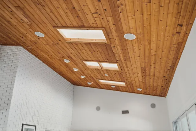 a kitchen with white cabinets sink and stainless steel appliances