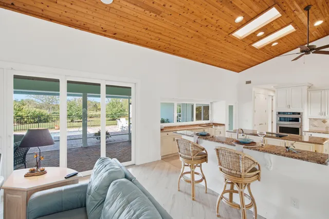 a kitchen with sink stove and cabinets