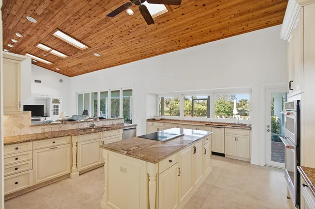 a spacious bedroom with a bed and a couch