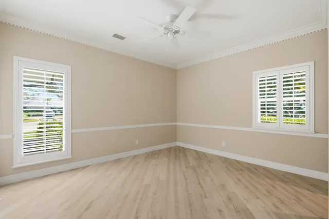 a view of a swimming pool with outdoor seating