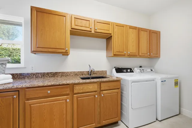 an aerial view of a house with a swimming pool