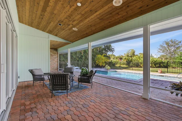 a view of a balcony with chairs