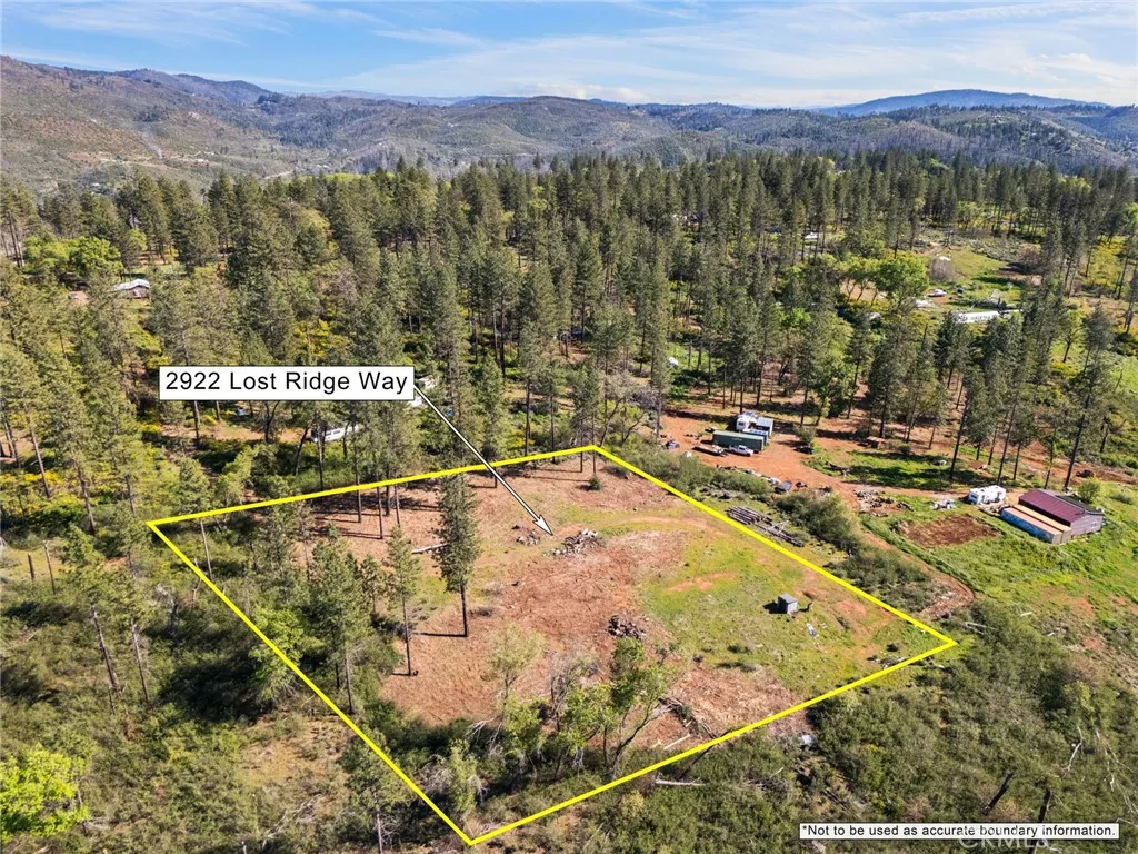 2922 Lost Ridge Oroville, CA 95965 - Photo 19 of 21 a view of a swimming pool with a table & chairs