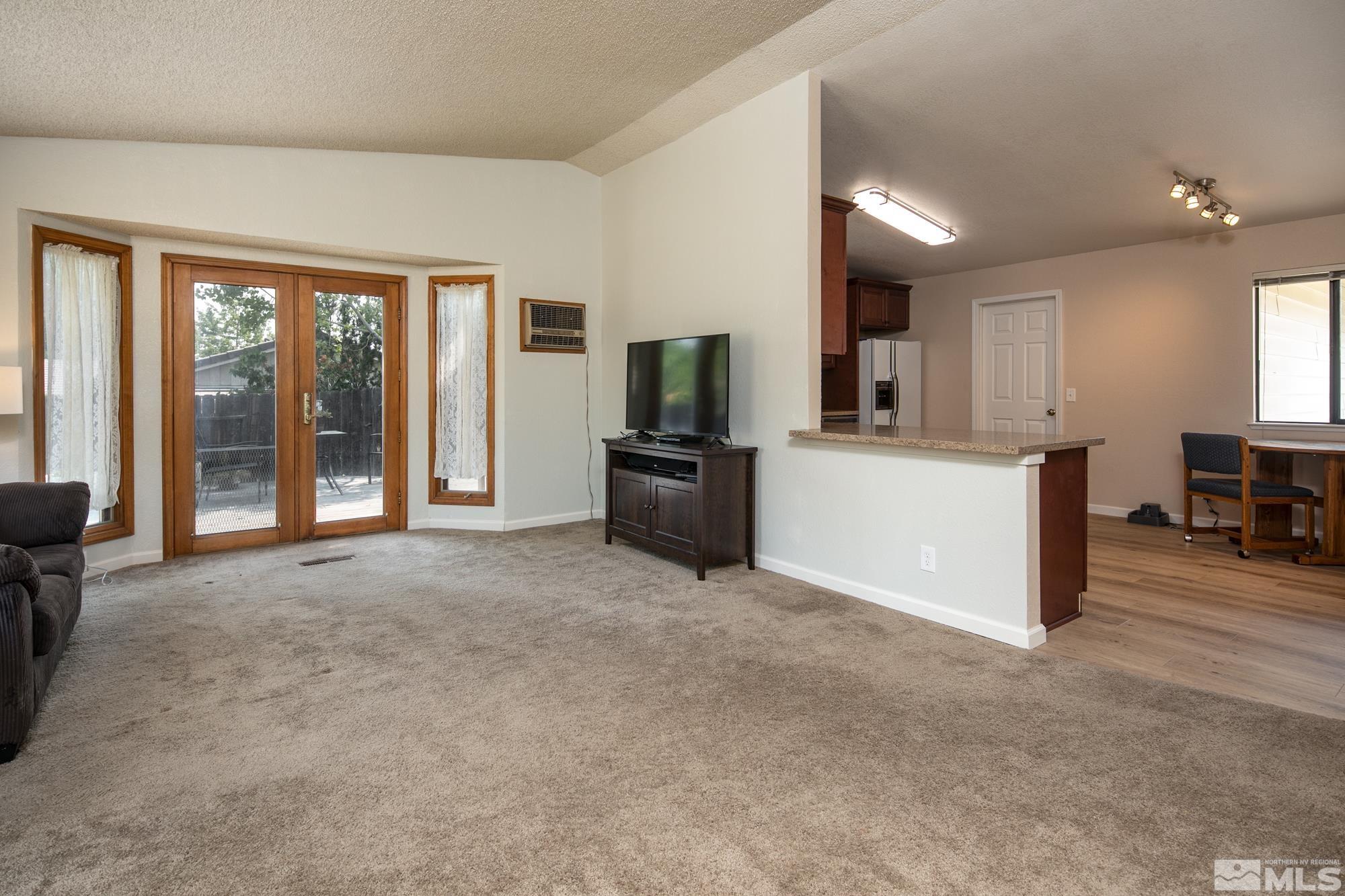 5335 Seville Court Reno, NV 89523 - Photo 11 of 31 a view of a kitchen with furniture and a refrigerator