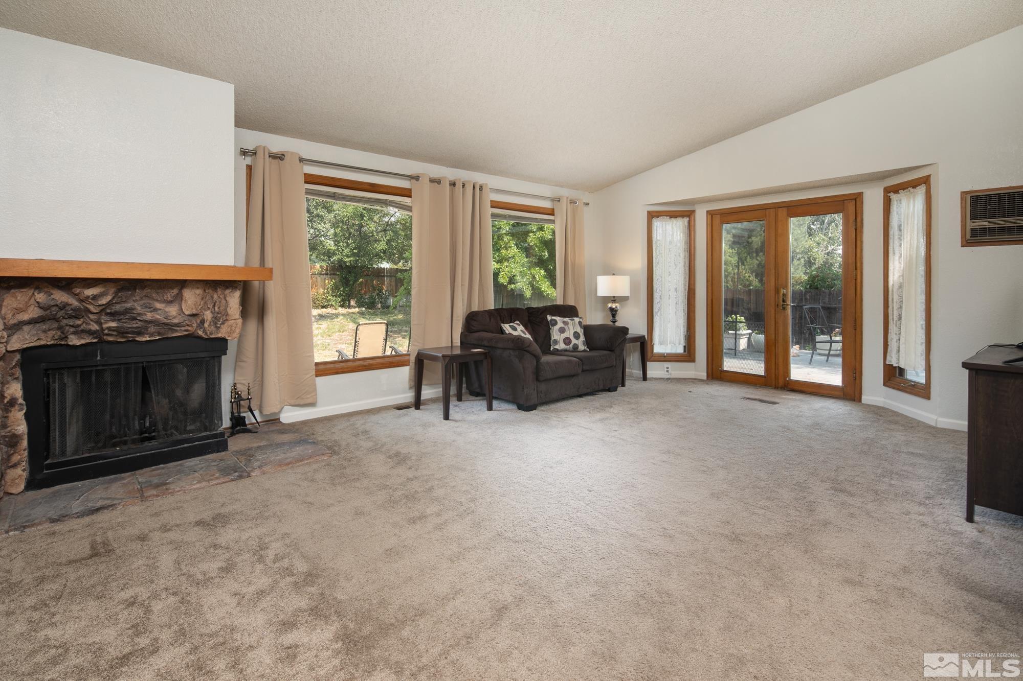 5335 Seville Court Reno, NV 89523 - Photo 12 of 31 a living room with furniture and a fireplace