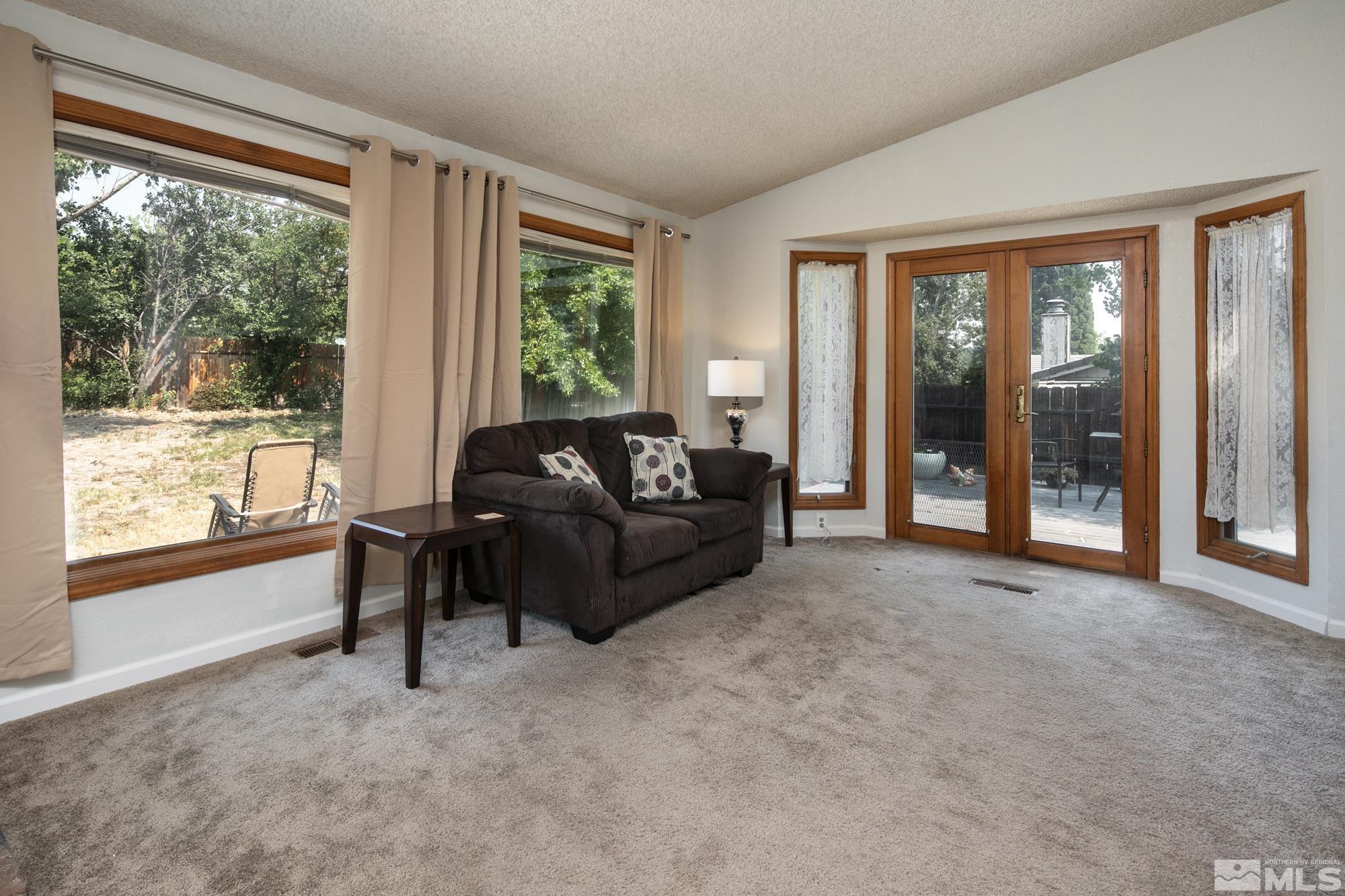 5335 Seville Court Reno, NV 89523 - Photo 13 of 31 a living room with furniture and a large window