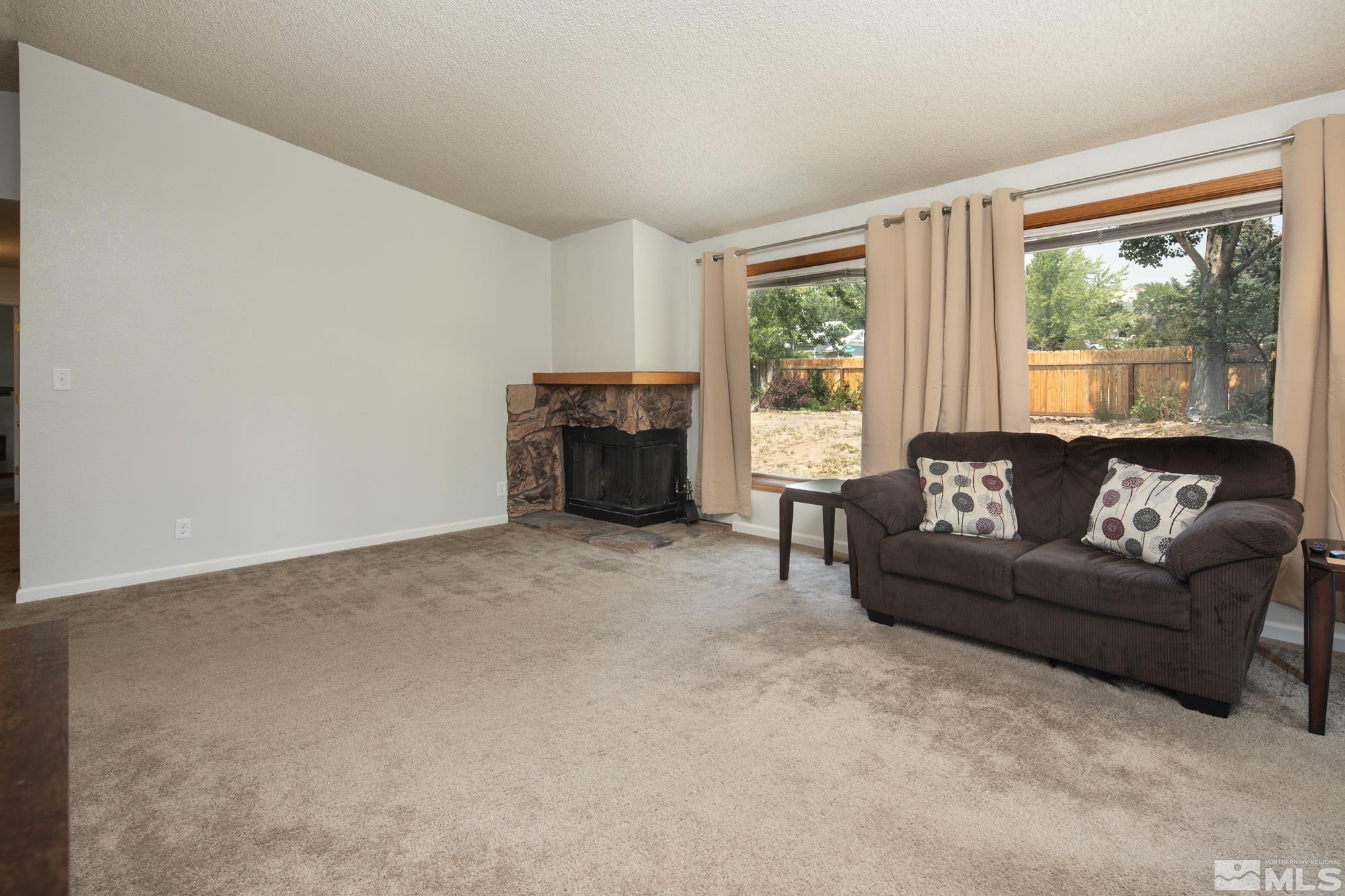 5335 Seville Court Reno, NV 89523 - Photo 14 of 31 a living room with furniture and a large window