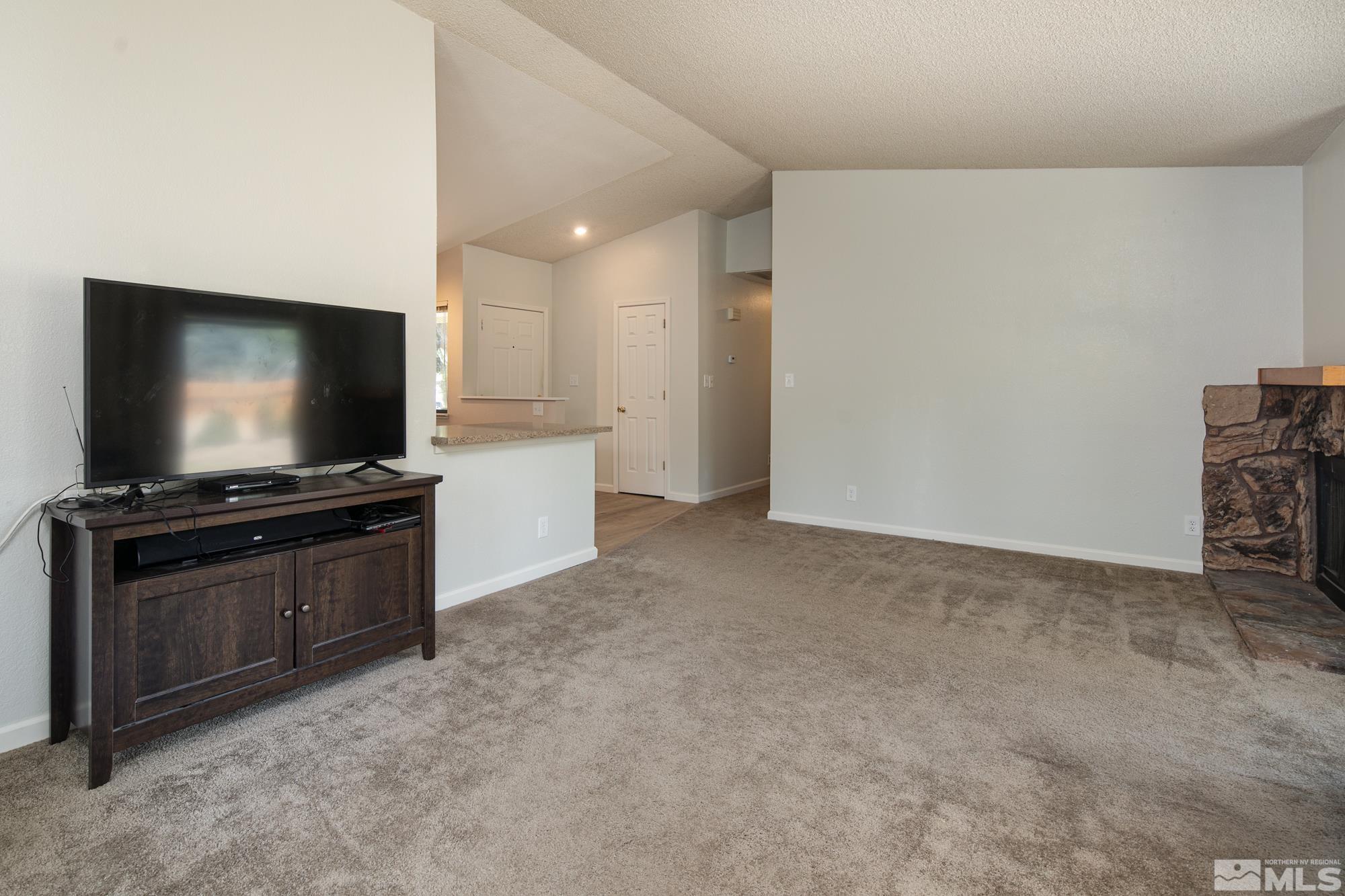 5335 Seville Court Reno, NV 89523 - Photo 16 of 31 a living room with furniture and flat screen tv